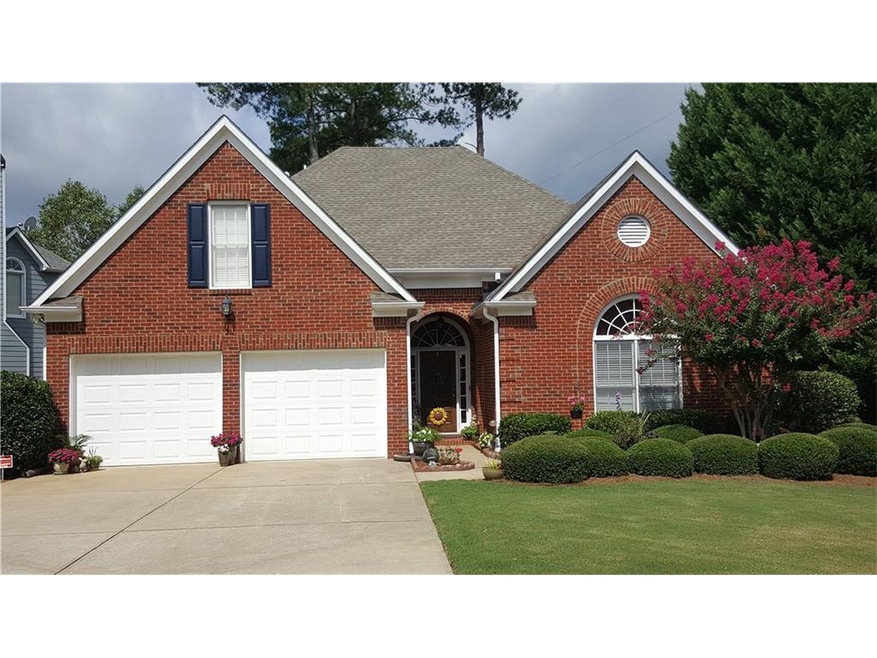 Three sides brick with beautiful landscaping.