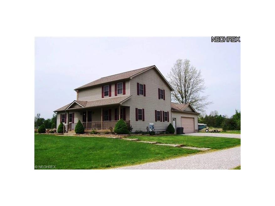 This stately custom colonial built in 2003 sits on