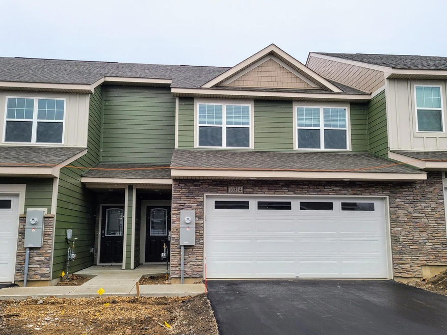 Fairfax Building exterior shown with Mountain Sage Hardi siding and Khaki Brown board & batten.  Ask Sales Agent for details.