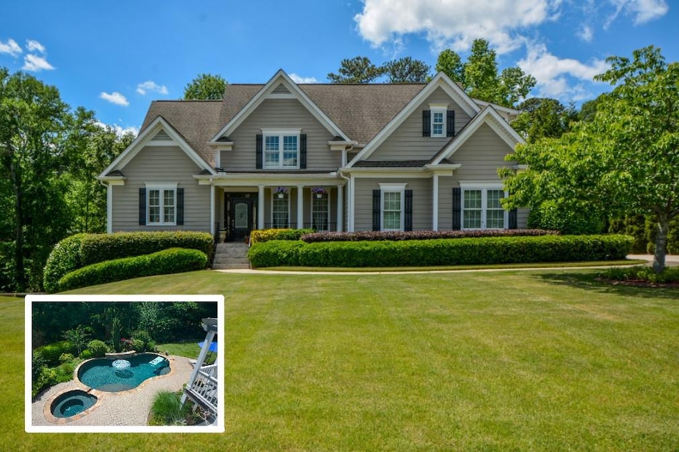 Craftsman-style home featuring a front yard, covered porch, and roof with shingles
