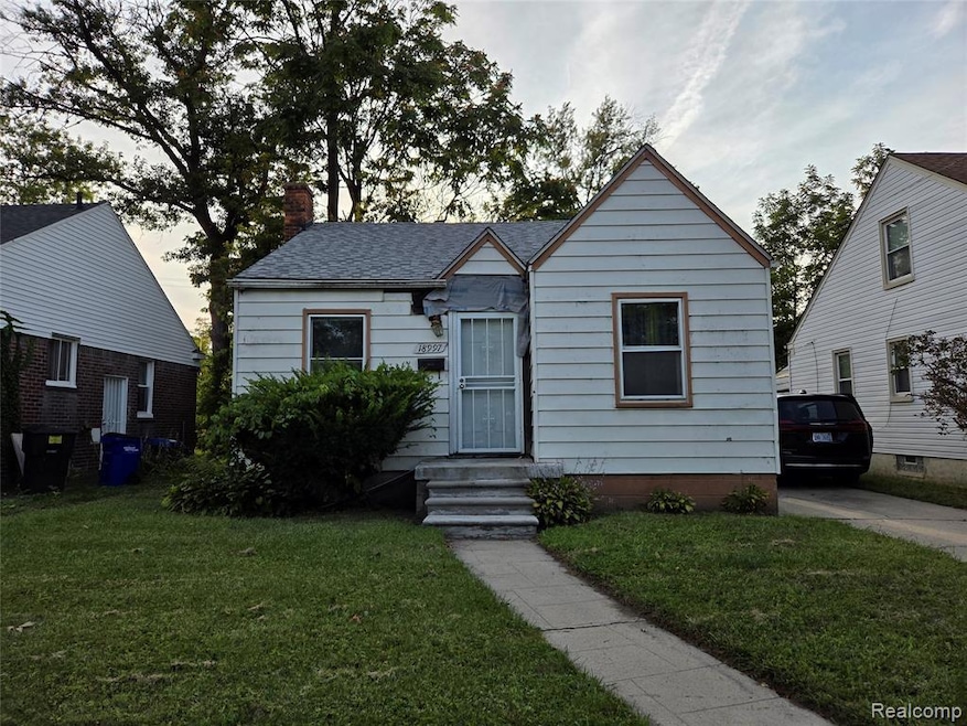 Bungalow-style home featuring a chimney and a front lawn