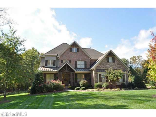 Exterior Front. Handsome brick & cast stone home has a broad covered front porch. Home enjoys a large 2.27 acre lot with a fully fenced backyard.