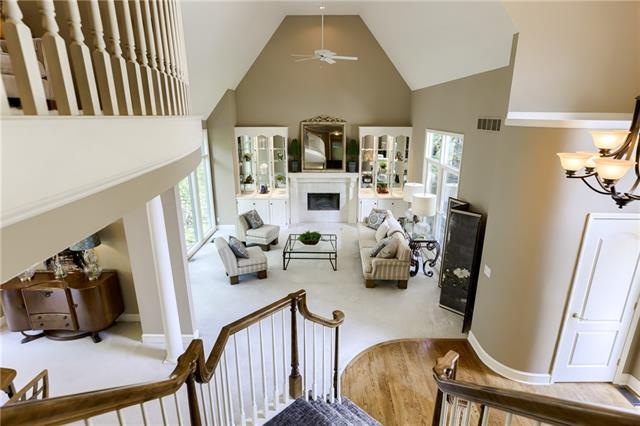 Stairway overlooking living, dining and grand entr