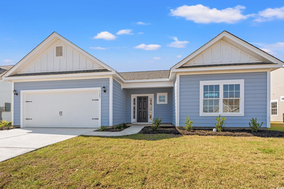Single story home with board and batten siding, a 