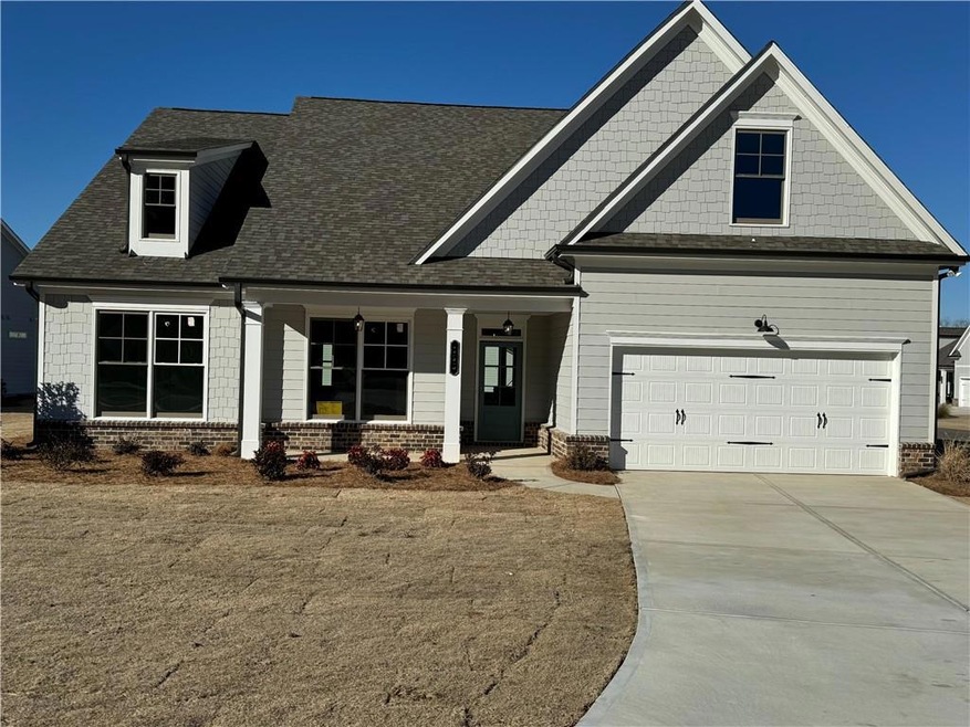 Craftsman house featuring a garage
