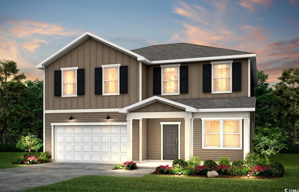 Traditional-style home featuring roof with shingle