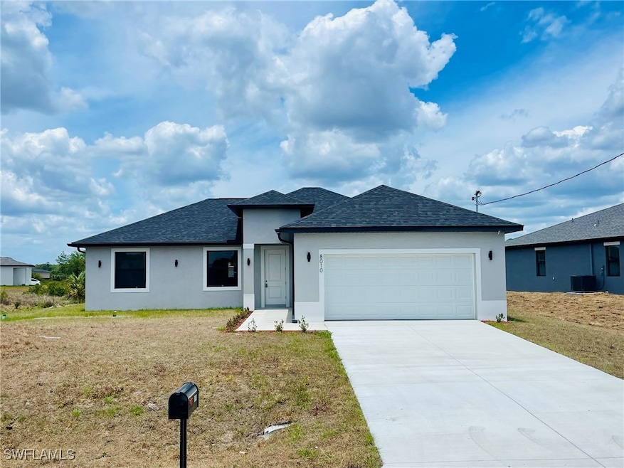 View of front of property with a shingled roof, a