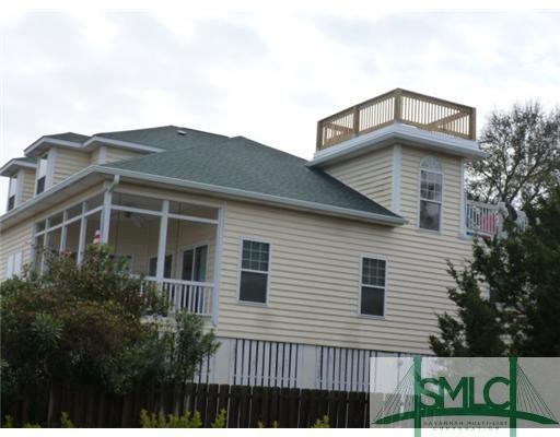 Exterior Front. New rooftop deck and roof and step