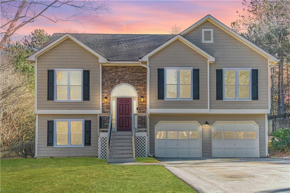 Raised ranch with attached two-car garage and spac
