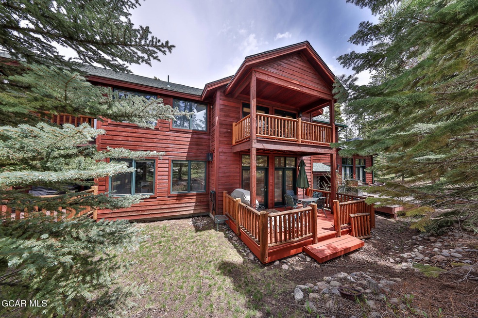 Large deck walks out to a natural yard