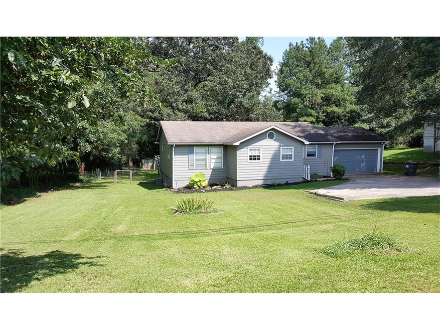 Perfect little ranch sits on a beautiful 1 Acre le