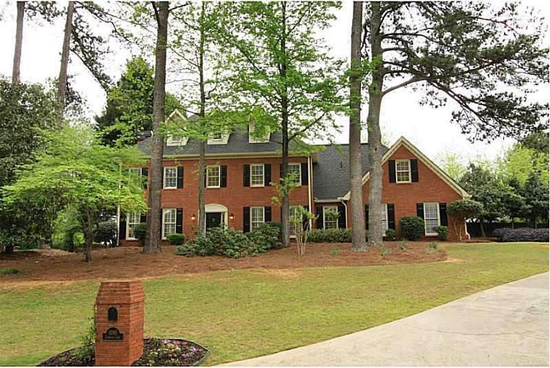 Exterior Front. STATELY BRICK & HARDIE PLANK HOME.