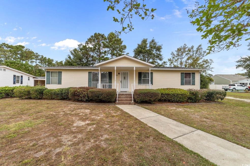 Single story home featuring a front lawn and a porch