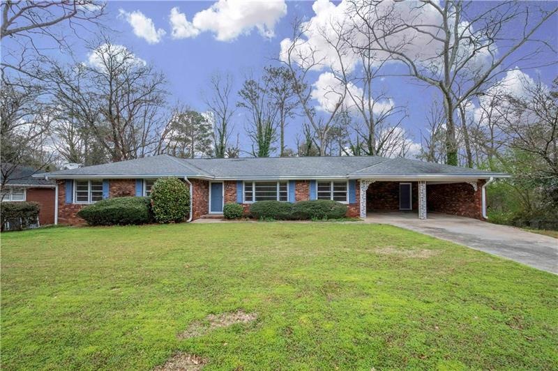 Lovely Brick Ranch with flat front yard.
