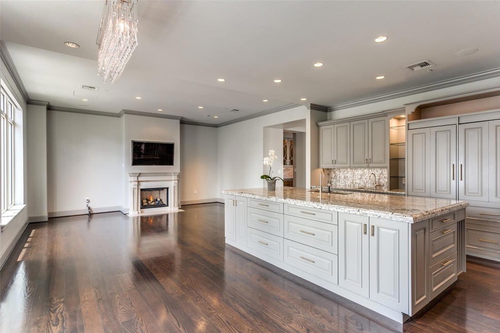Kitchen featuring light stone countertops, a large