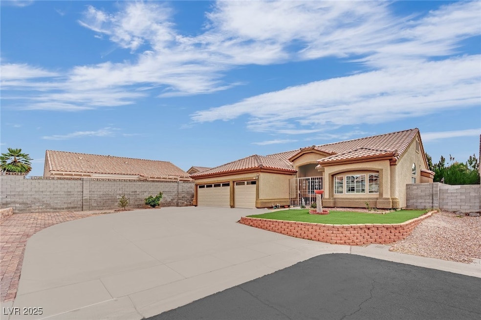 Mediterranean / spanish home featuring driveway, f