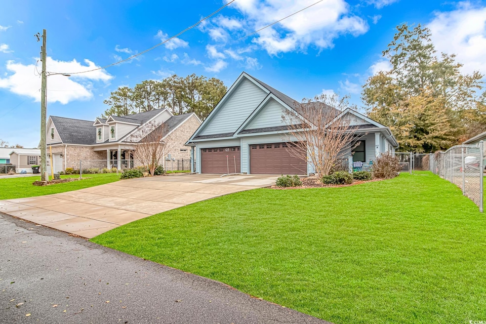 Craftsman-style house featuring fence, an attached