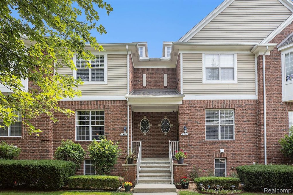 Traditional-style home with brick siding