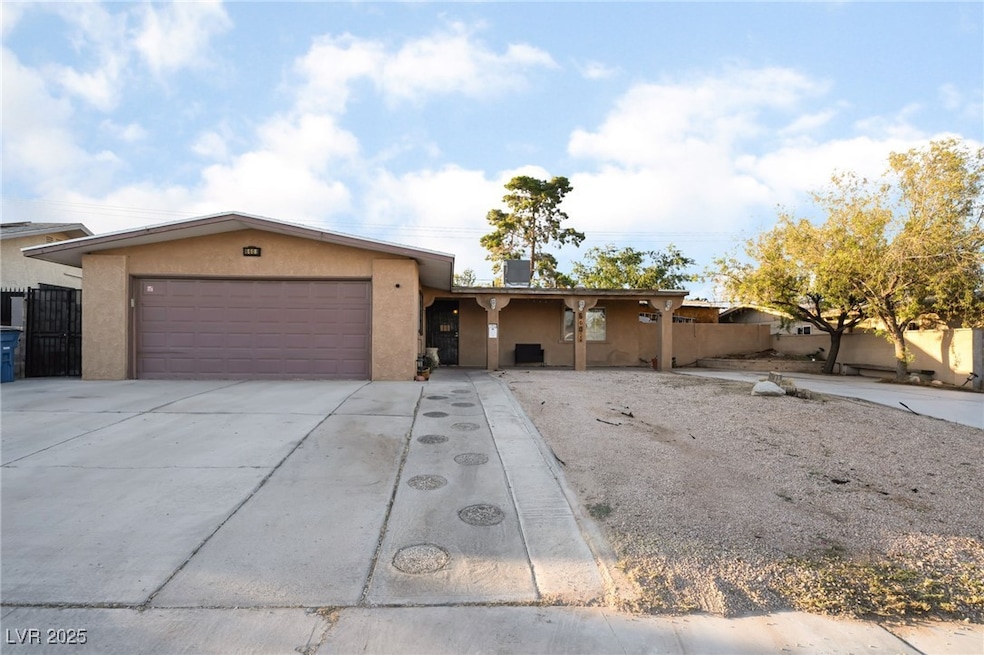 Single story home featuring stucco siding, an atta