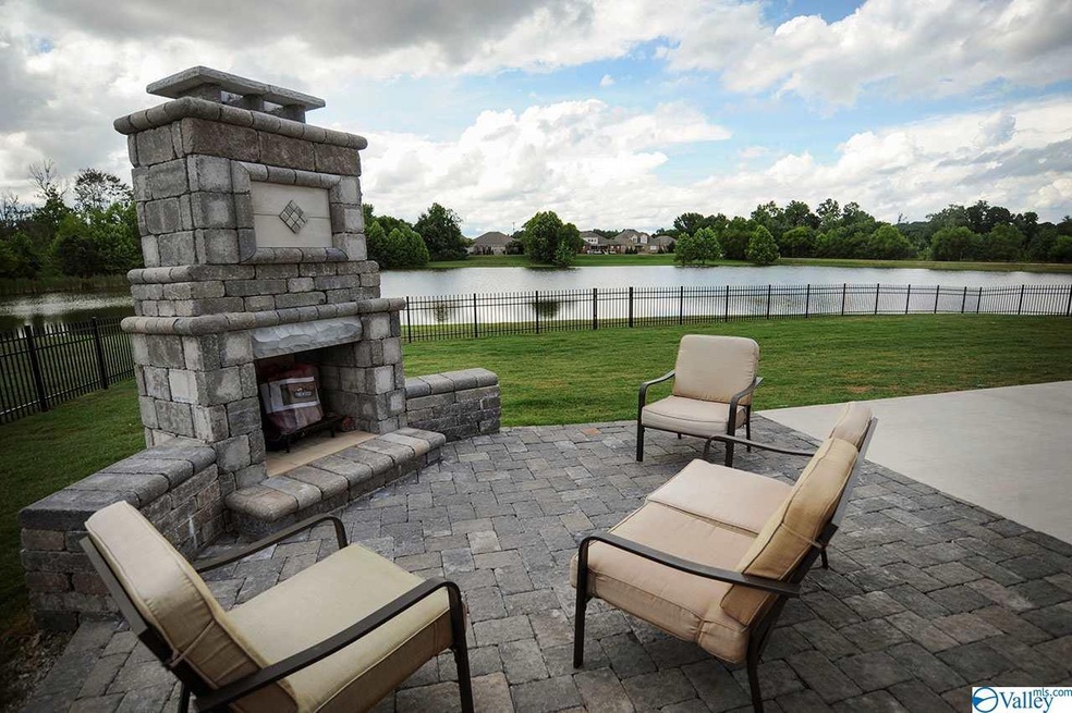 Extended patio with fireplace offers a lovely space to enjoy your lake views.