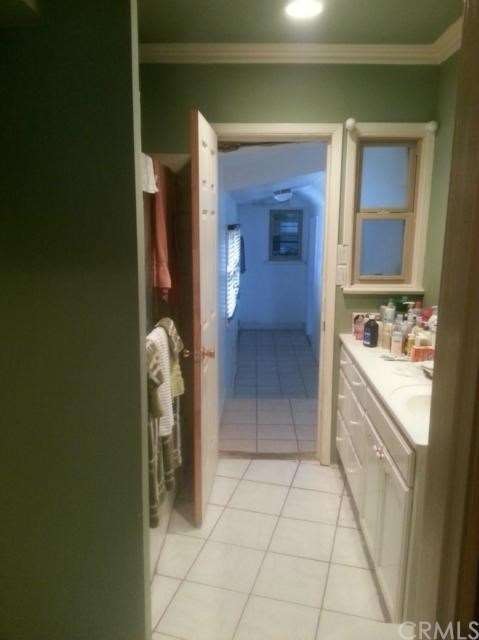 1st Bathroom leading to the 3rd Bedroom and Den Ar