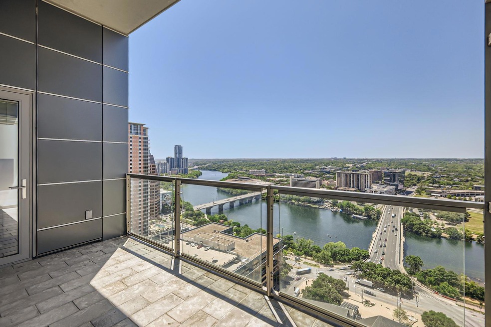 Balcony with a city view and a water view