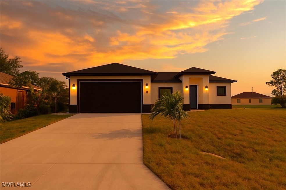 Prairie-style house with driveway, stucco siding,
