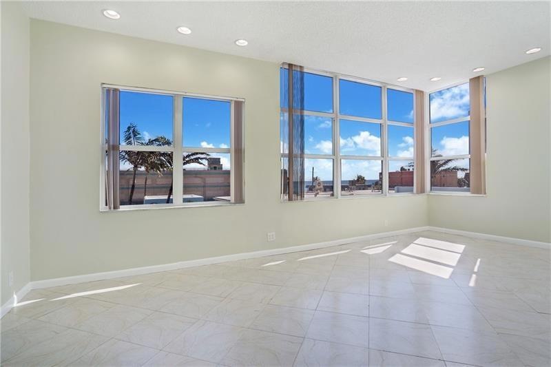 Spacious living dining area all tiled with impact