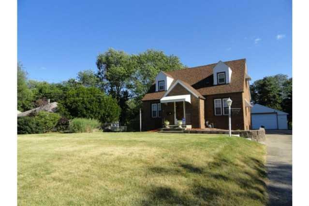 Exterior Front. Brick 1.5 Story on Large Lot