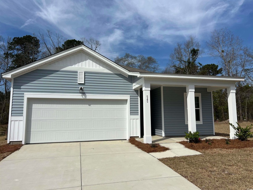 Single story home with an attached garage, covered