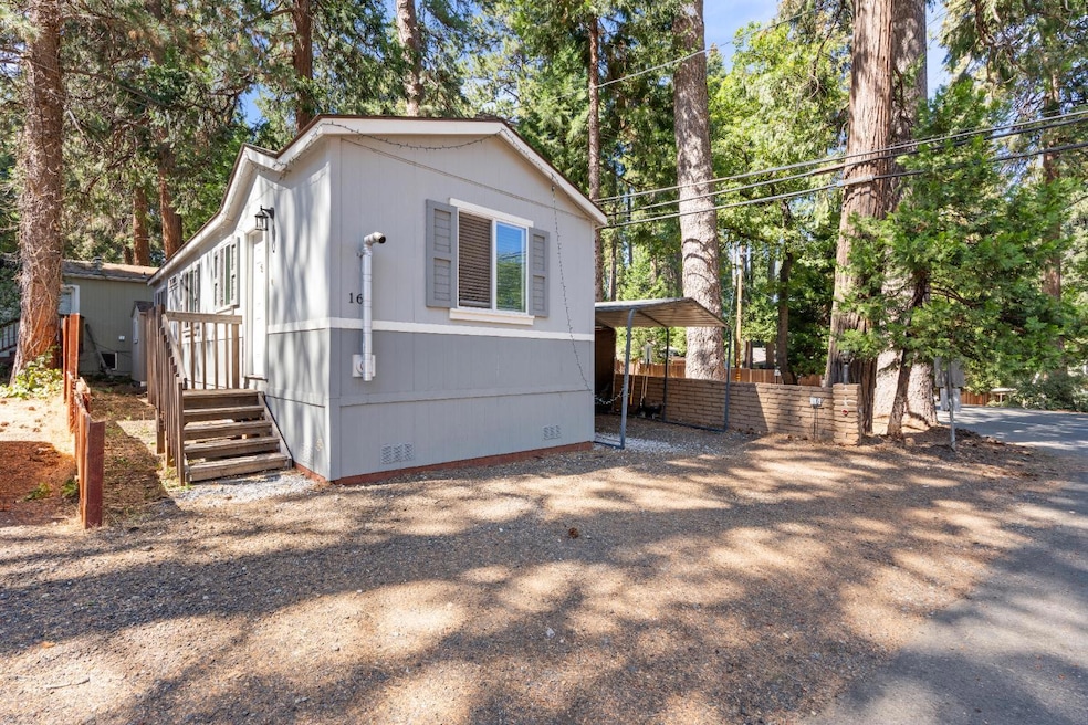 Newer Manufactured Home with Carport, Finish Shed and larger side deck.
