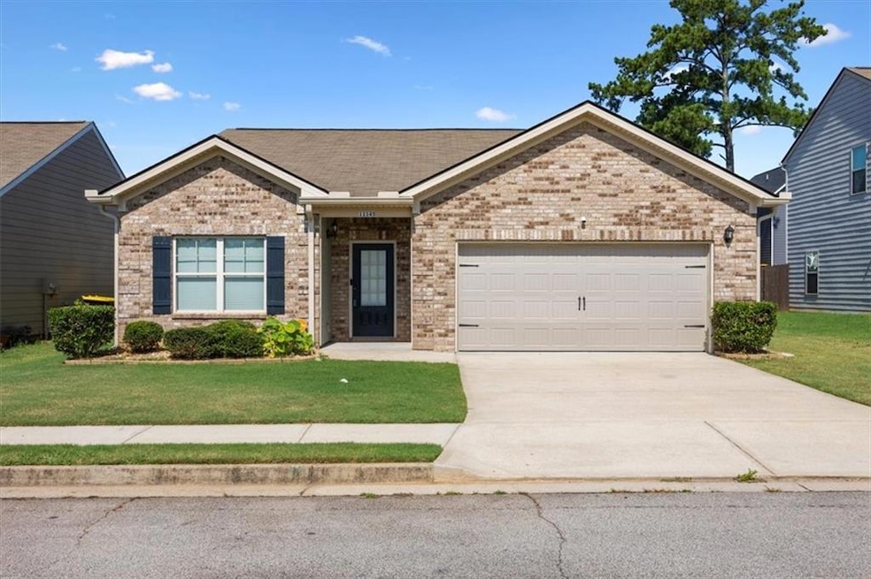 Craftsman house with a garage and a front yard