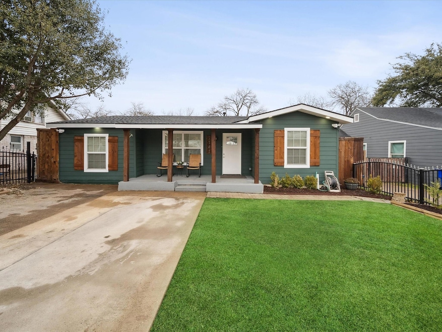 Single story home featuring a front yard and cover