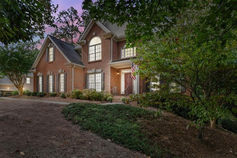 Beautiful 3 sided brick home on prime lot nestled 