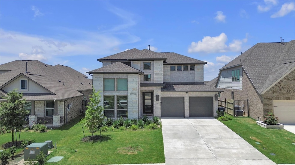View of front of house featuring concrete drivewa