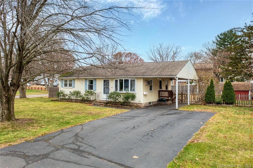 Front exterior.  Lovely corner lot, large driveway