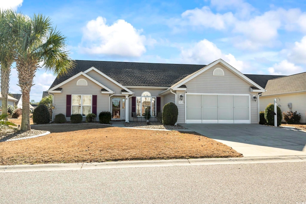 Single story home featuring a garage