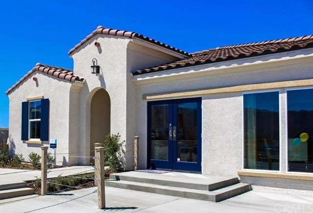 Exterior photo of model home.  Garage has been con