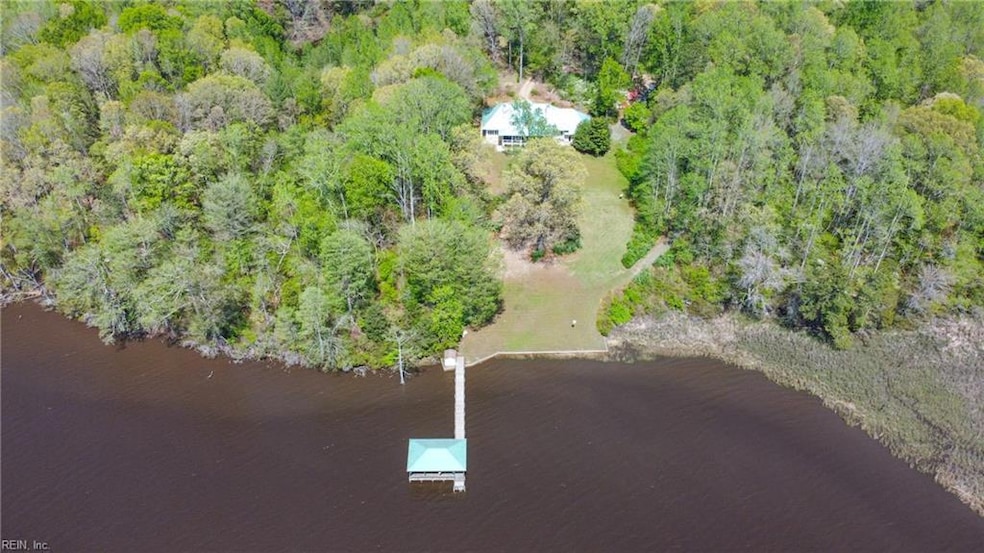 Aerial view of homesite, pier and covered dock/boatlift