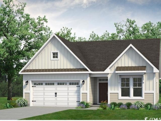 View of front of property with board and batten si