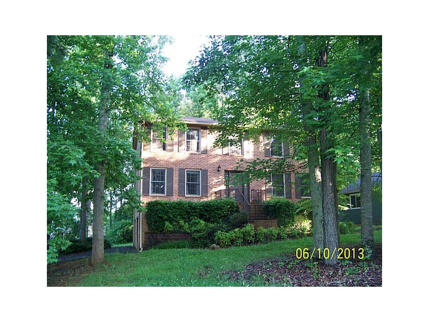 Exterior Front. Brick and Frame 2 Story w/ mature 