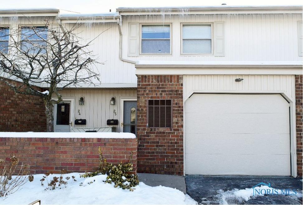 Close up view of unit #25 with 1-car garage