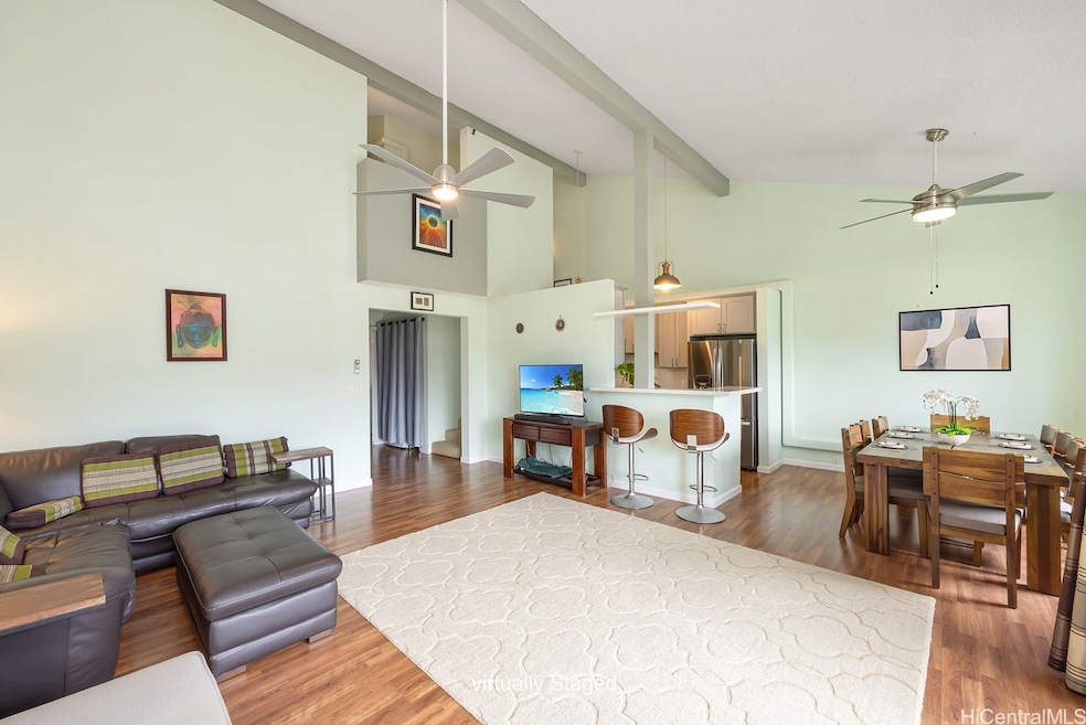 Spacious open-concept living with vaulted ceilings