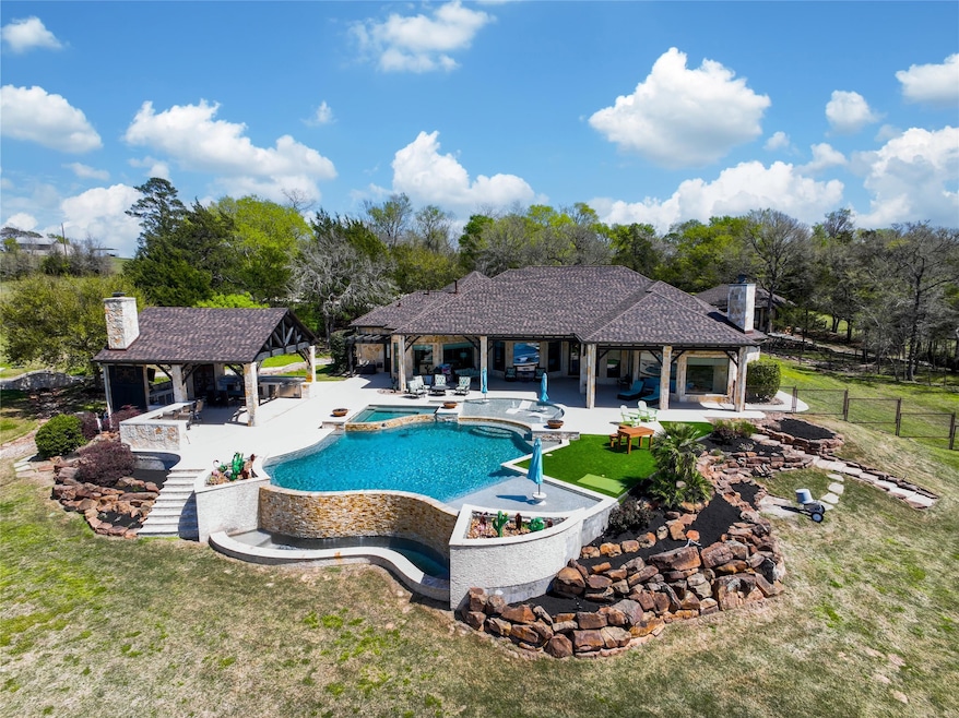 A breathtaking resort-style pool, outdoor kitchen,