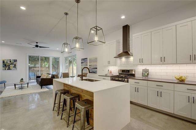 Kitchen flows directly into the dining and living 