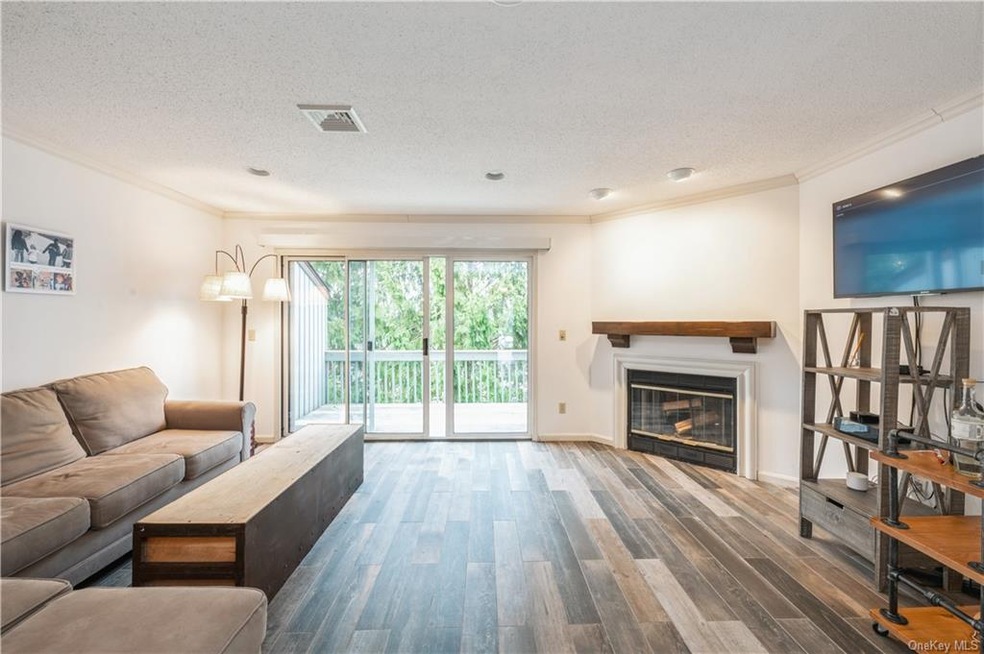 Living room which new floors leading to sliders