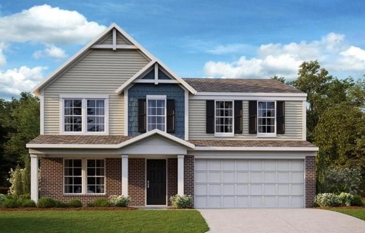 View of front of house with concrete driveway, an 