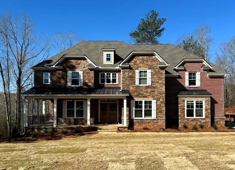 Craftsman-style house with a shingled roof, a fron