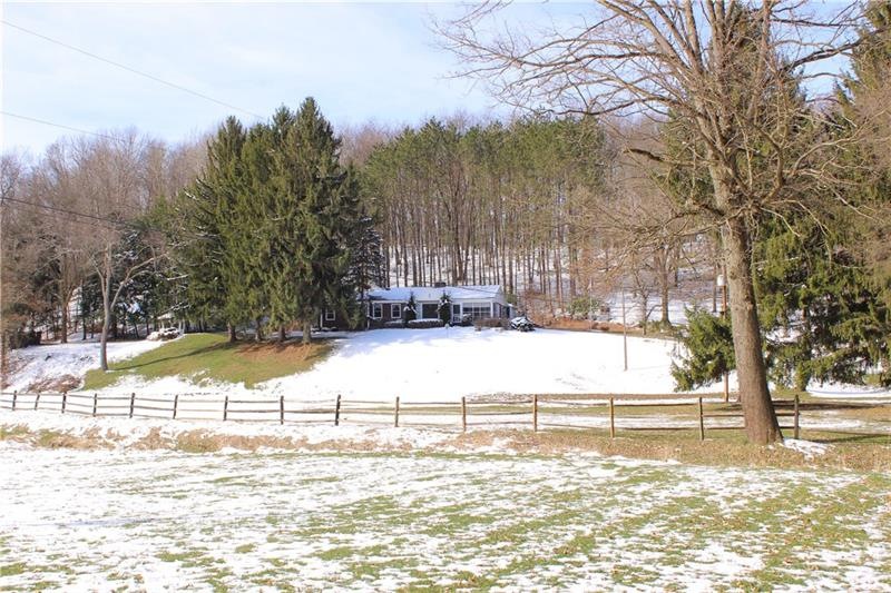 View of front of home showing privacy of 8.41 acre