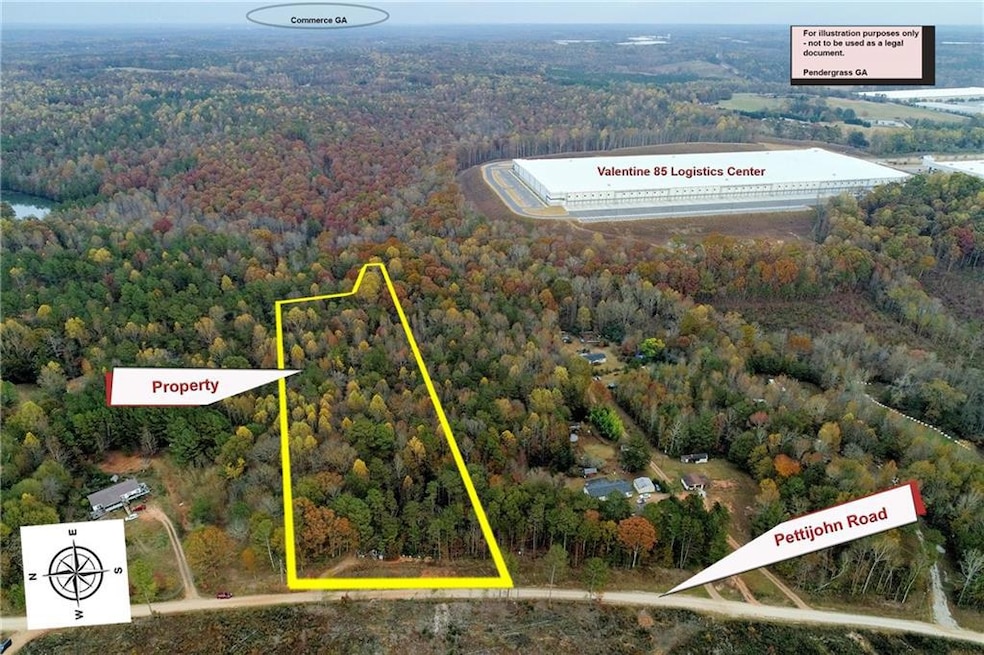 Drone / aerial view featuring a wooded view